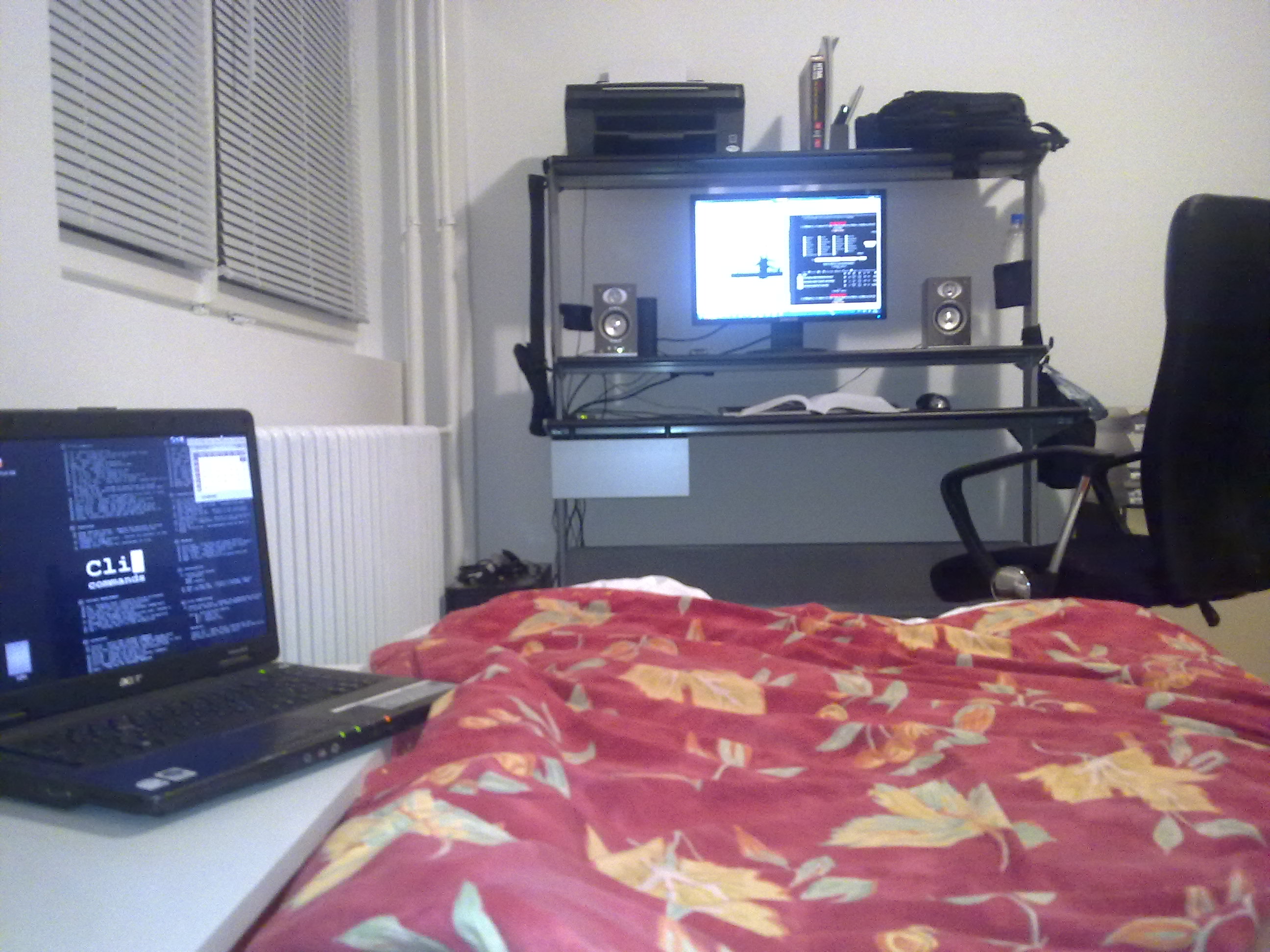 My small room with PC, laptop and a bed.